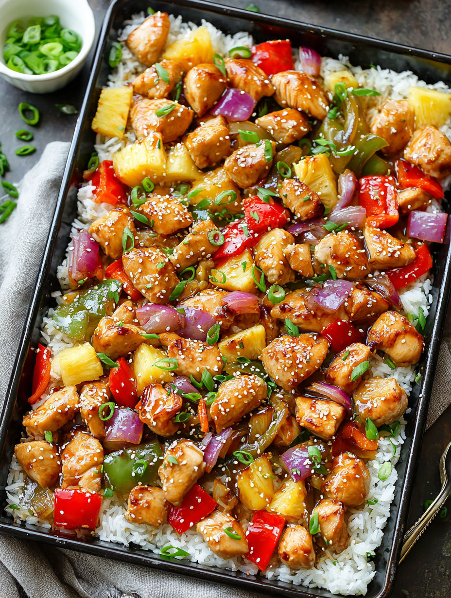 A delicious Hawaiian chicken dish with rice and vegetables.