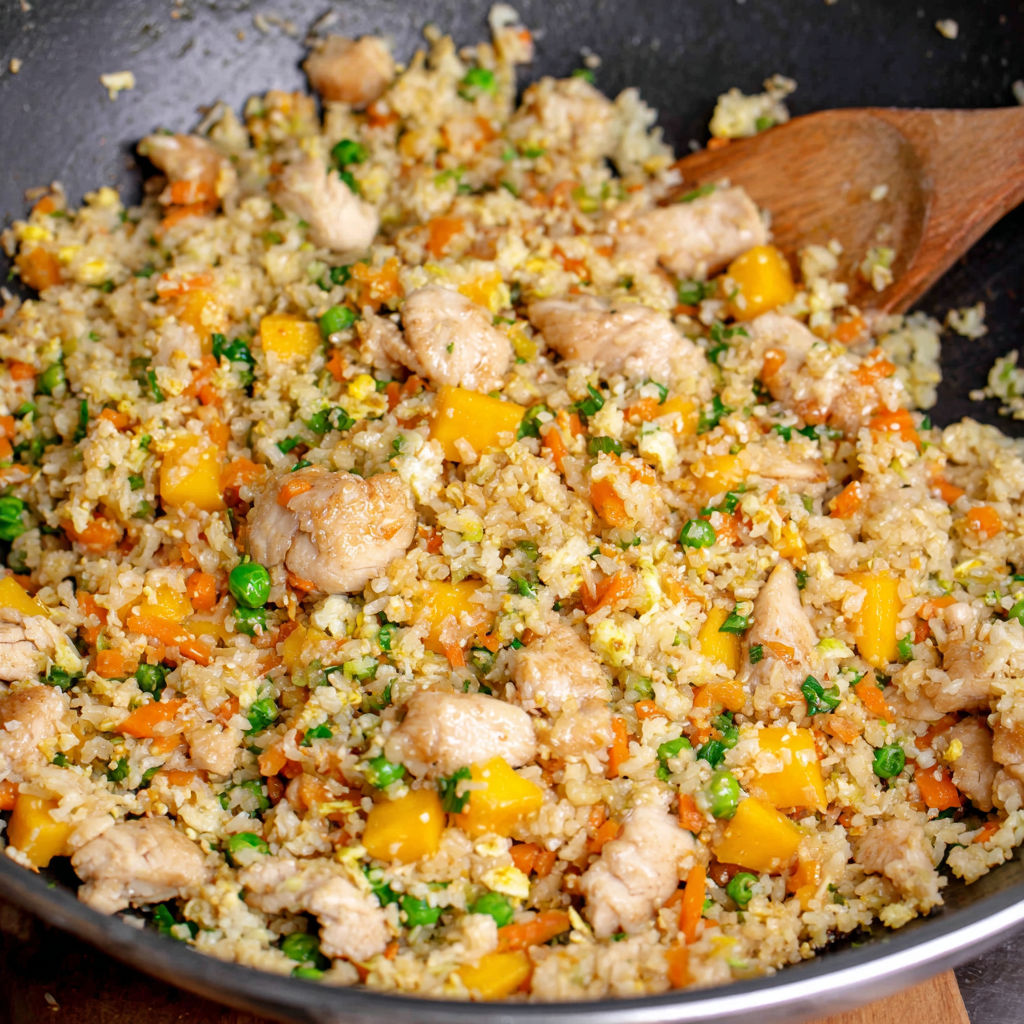 A bowl of Mango Chicken Fried Rice.