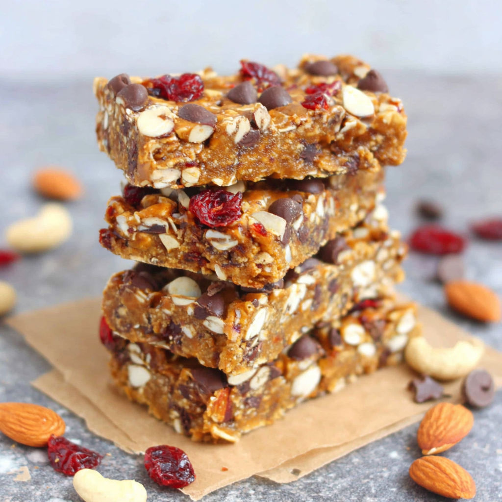 A stack of granola bars with chocolate chips and nuts.