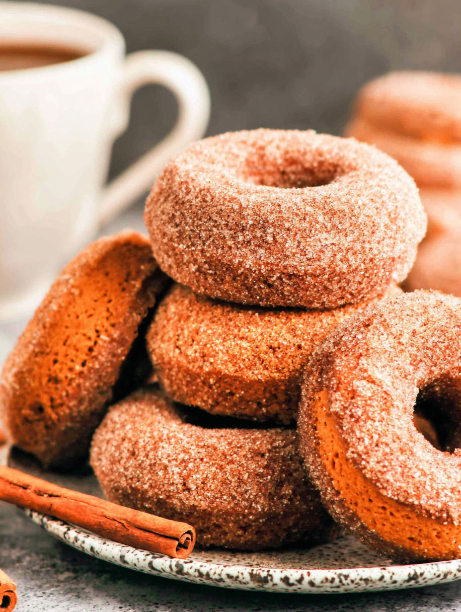 A stack of sugar donuts.
