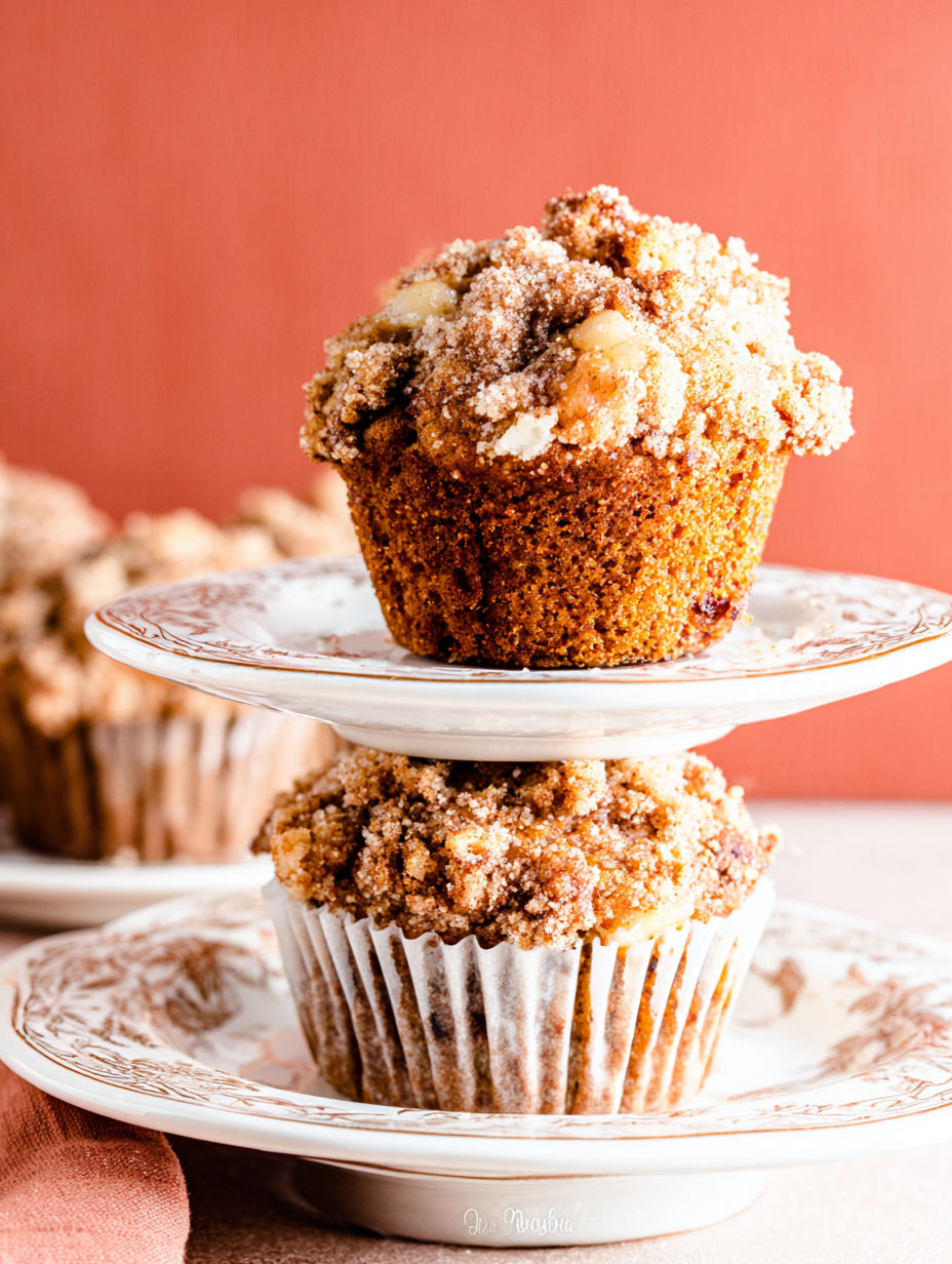Three muffins with streusel topping.