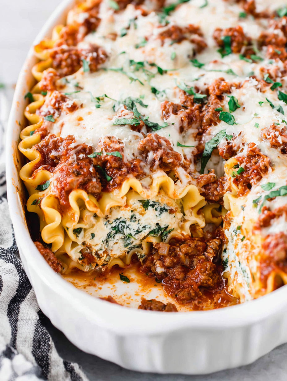 A plate of lasagna roll-ups.
