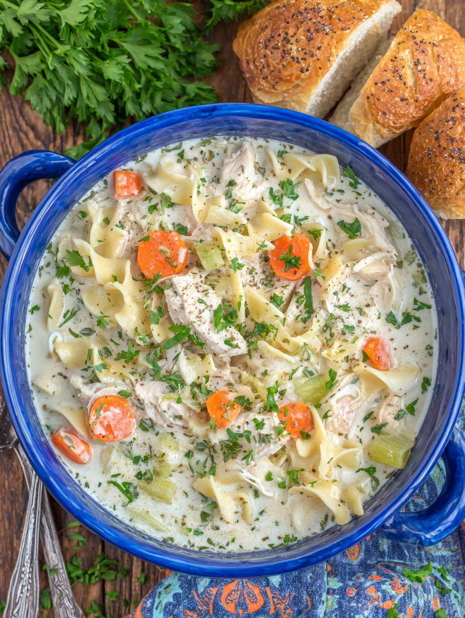 A bowl of creamy chicken noodle soup.