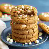 A stack of Biscoff cookies on a plate.