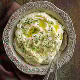 A bowl of creamy mashed potatoes.