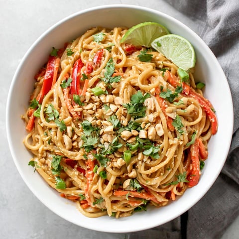 A bowl of peanut butter noodles.
