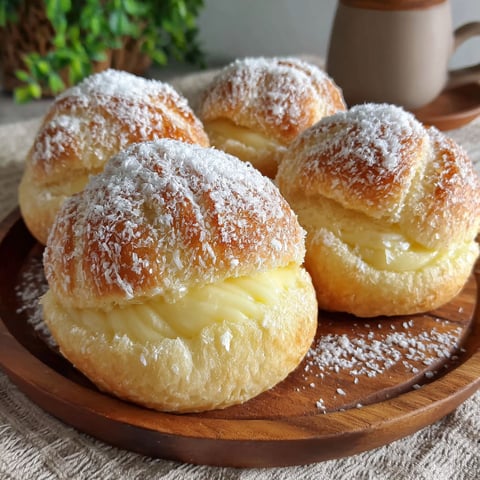 Three pieces of bread with powdered sugar on top.