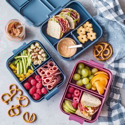 A variety of foods in a blue container.