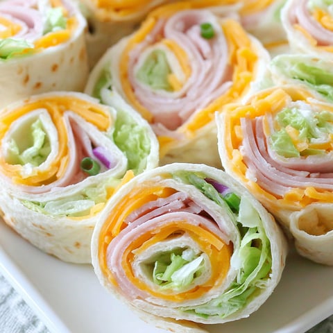 A plate of turkey roll ups.