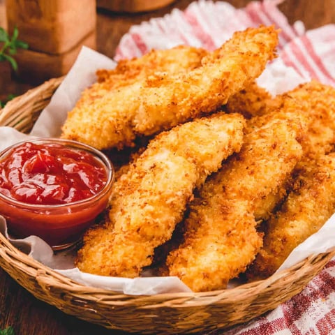 A basket of homemade chicken tenders.