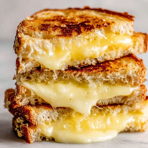 A stack of grilled cheese sandwiches.