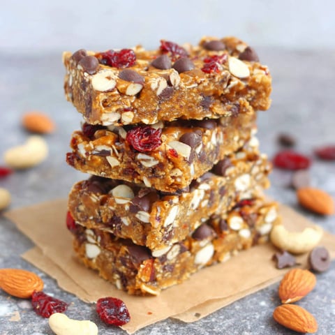 A stack of granola bars with chocolate chips and nuts.