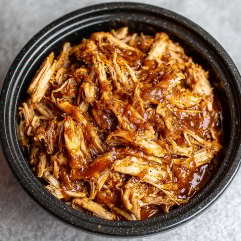 A bowl of slow cooker BBQ pulled pork.