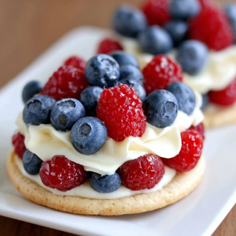 A plate of mini fruit pizza cookies.