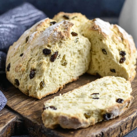 A slice of Irish soda bread with raisins.