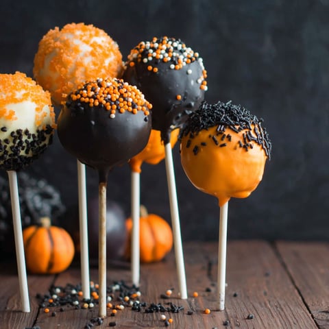 Halloween cake pops on a table.