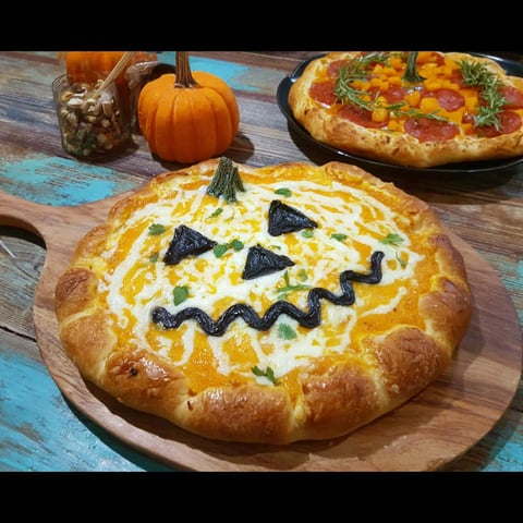 A pumpkin-crust Halloween pizza.